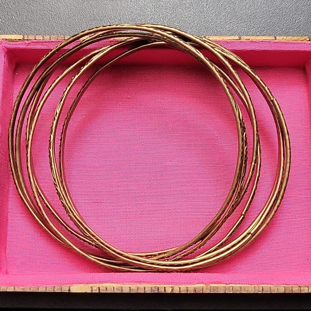7 Brass /Goldish bracelets connected